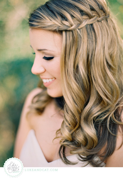 Closeup bridal portrait of bride with blonde hair and a waterfall braid.